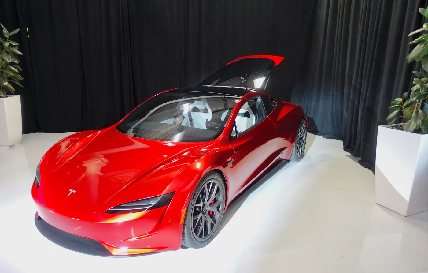Front three-quarter view of the red earlier Roadster prototype photographed in April 2019